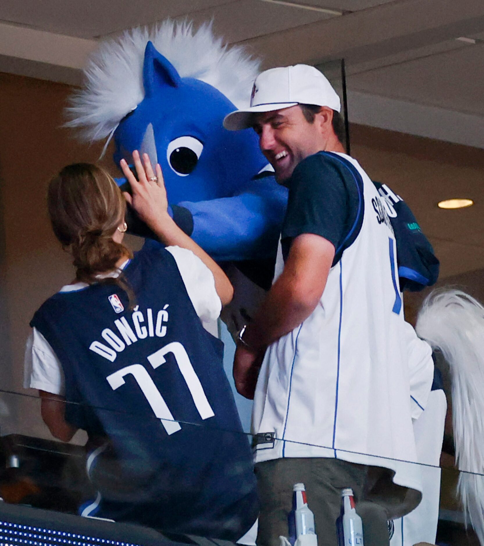 Master’s champion Scottie Scheffler dons a Dallas Mavericks jersey given him by Champ the...