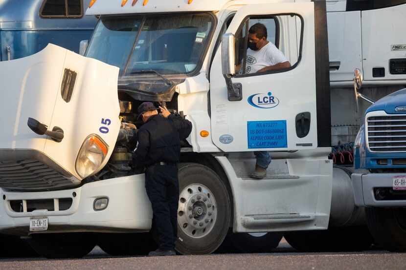 A Texas State Trooper commercial motor vehicle inspects trucks near the Pharr–Reynosa...
