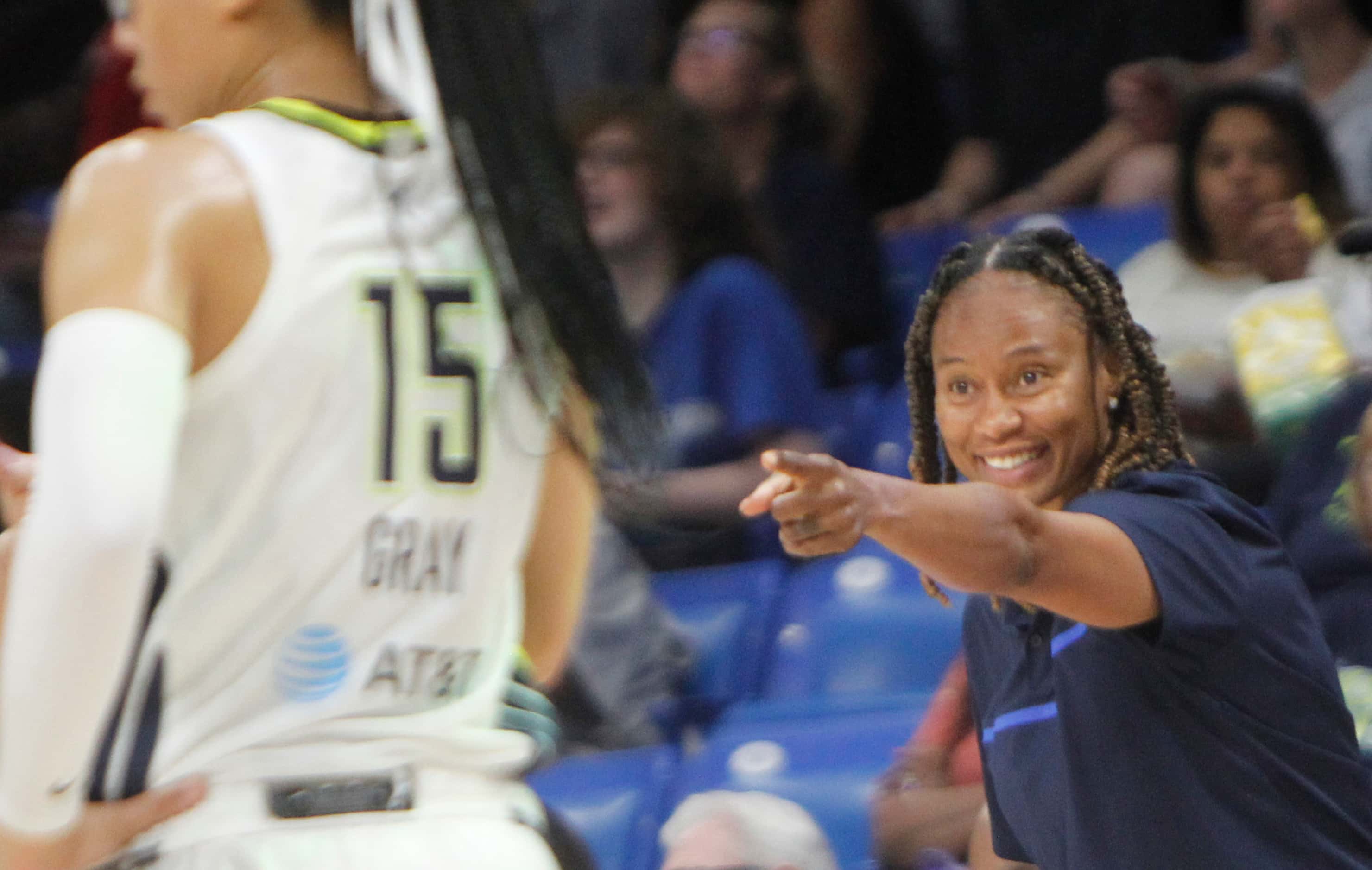 Dallas Wings head coach Vickie Johnson reacts to a Wings score during second quarter action...