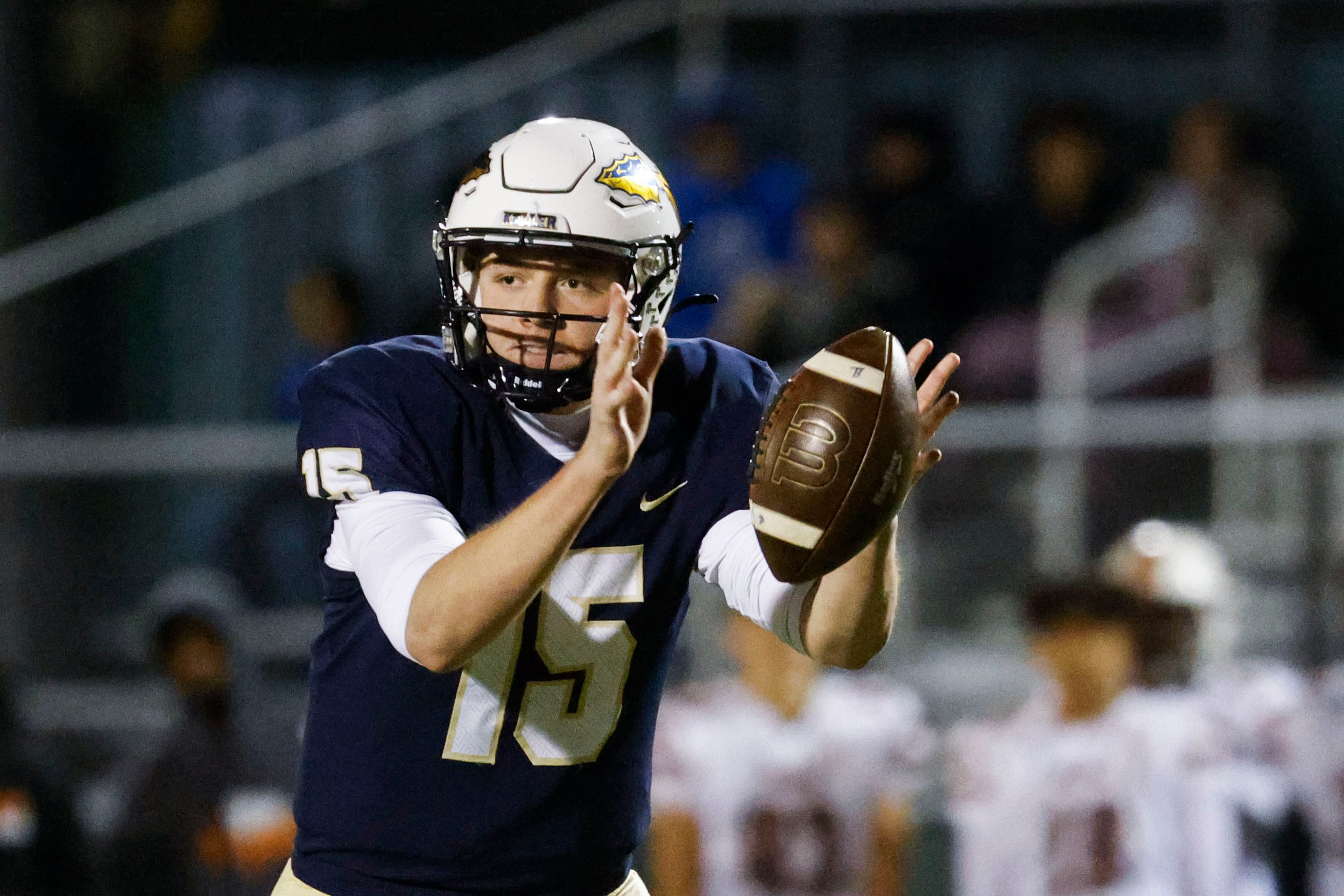 Keller high’s Beckham Robinson looks to hand off the ball against Haltom high during the...