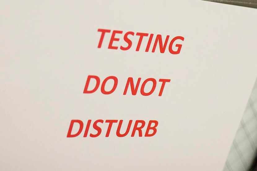 
A sign warns guests that students are testing, at Akins High School in Austin,.
