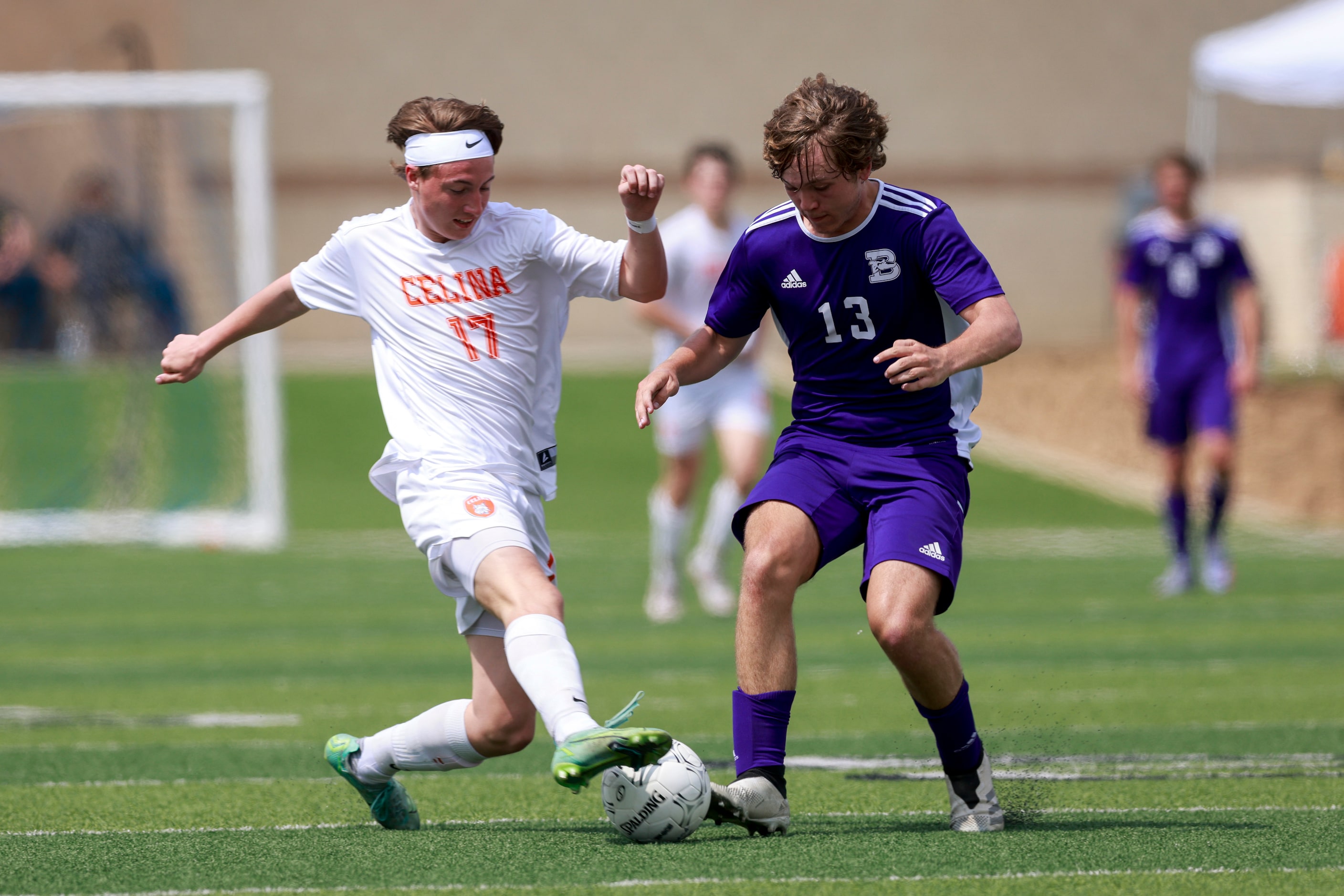 Celina defender William Brown (17) battles for a loose ball against Boerne’s Logan Walter...