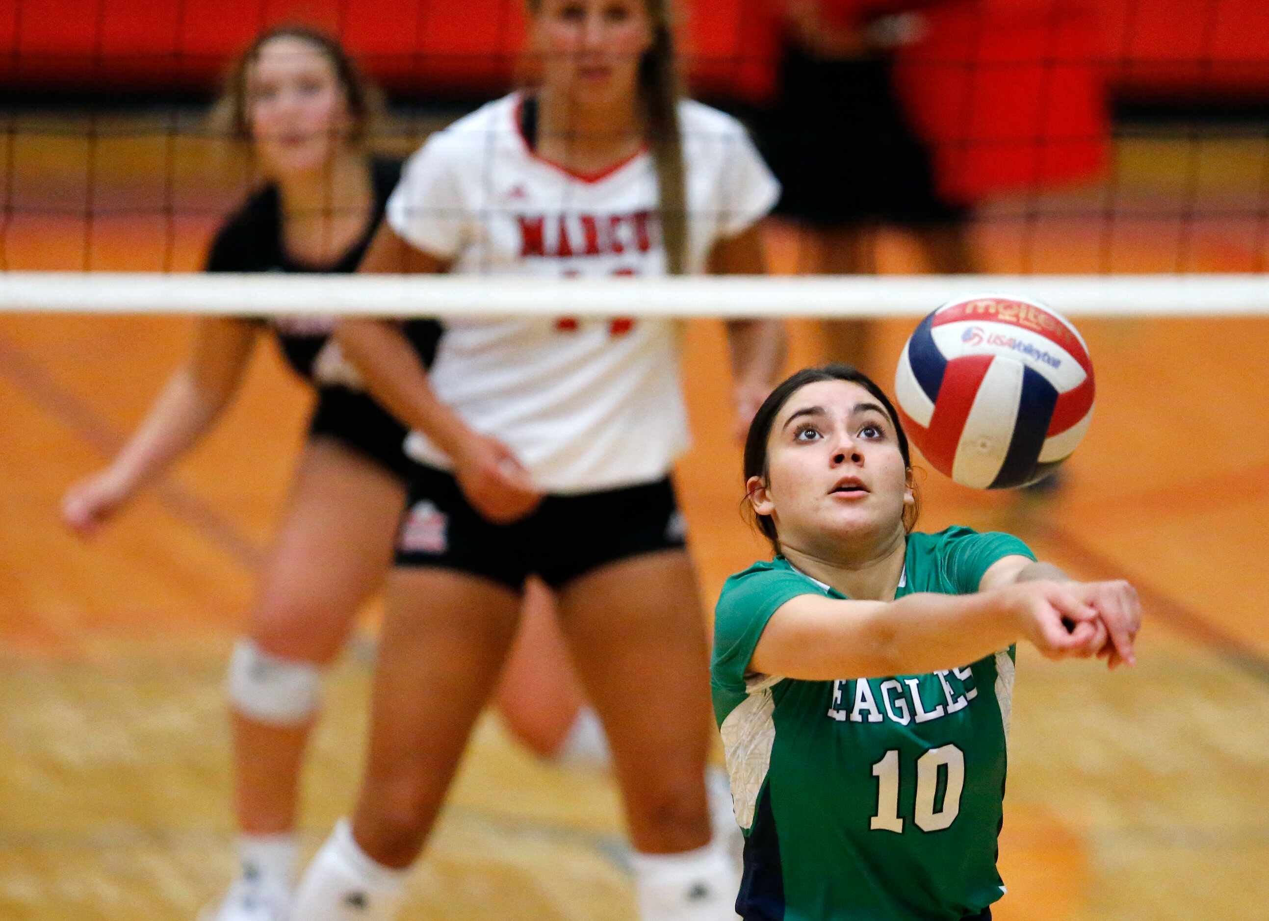 Eaton’s setter Lorena Gomez (10) keeps a volley alive in game one as Flower Mound Marcus...