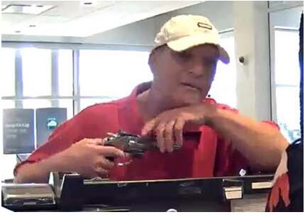 The man robbed the teller at gunpoint.