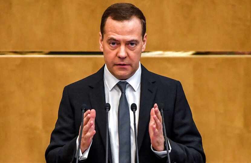 Russia's Prime Minister Dmitry Medvedev delivers a speech at the lower house of Russian...