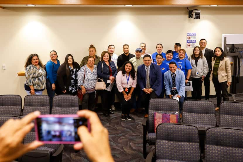 Dallas residents alongside District 5 council member Jaime Resendez (center right) pose for...