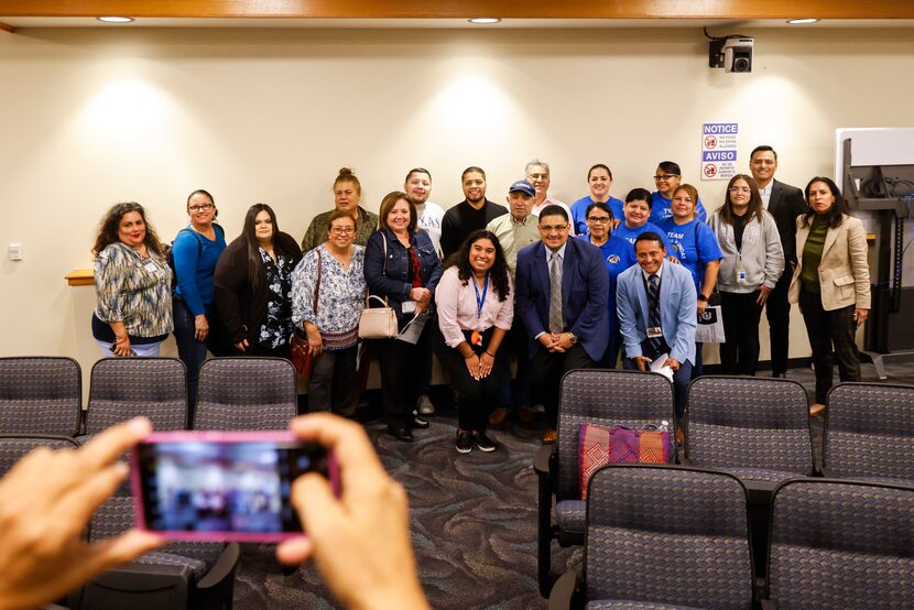 Dallas residents alongside District 5 council member Jaime Resendez (center right) pose for...