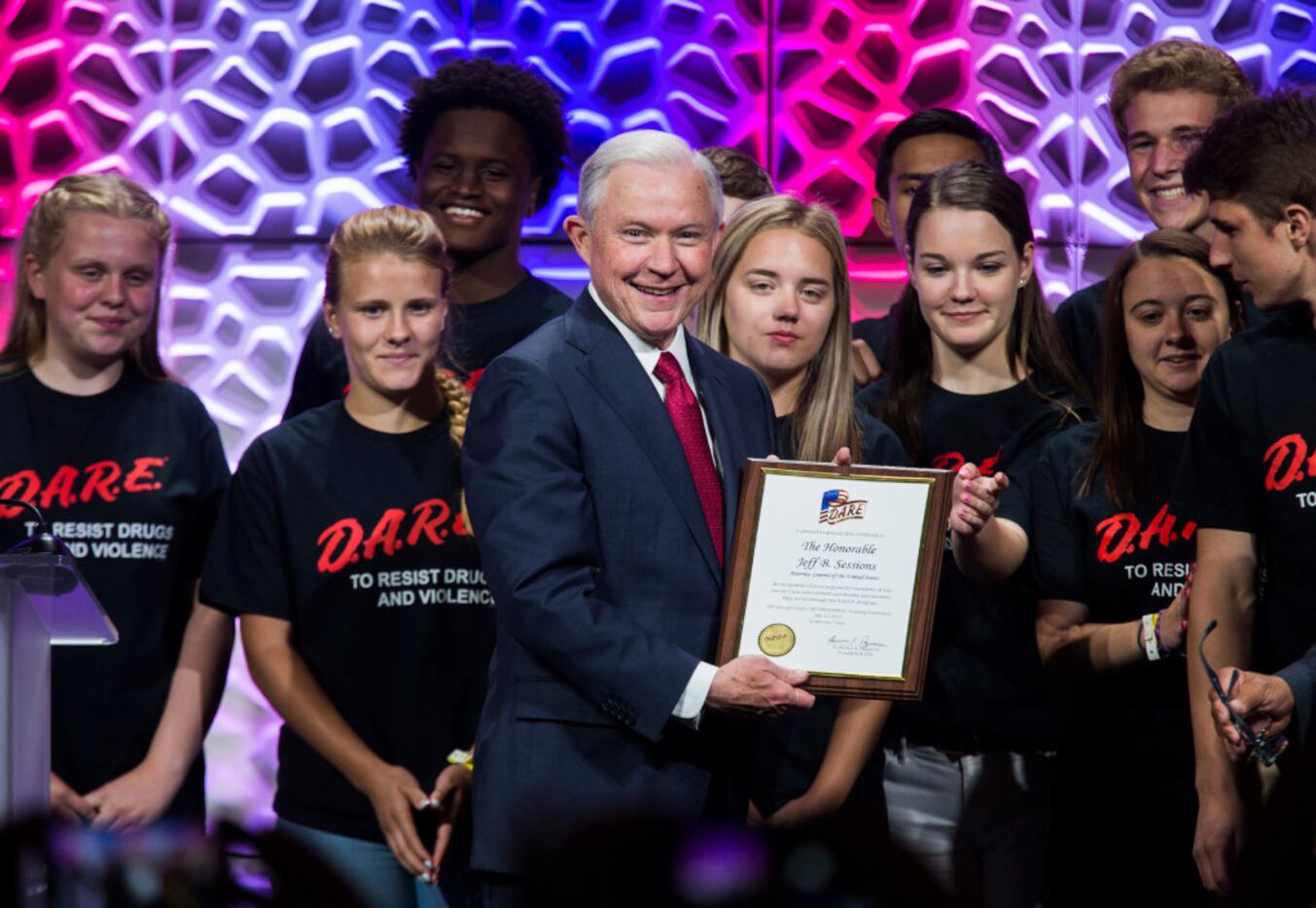 U.S. Attorney General Jeff Sessions is presented with a plaque from the DARE youth advocacy...