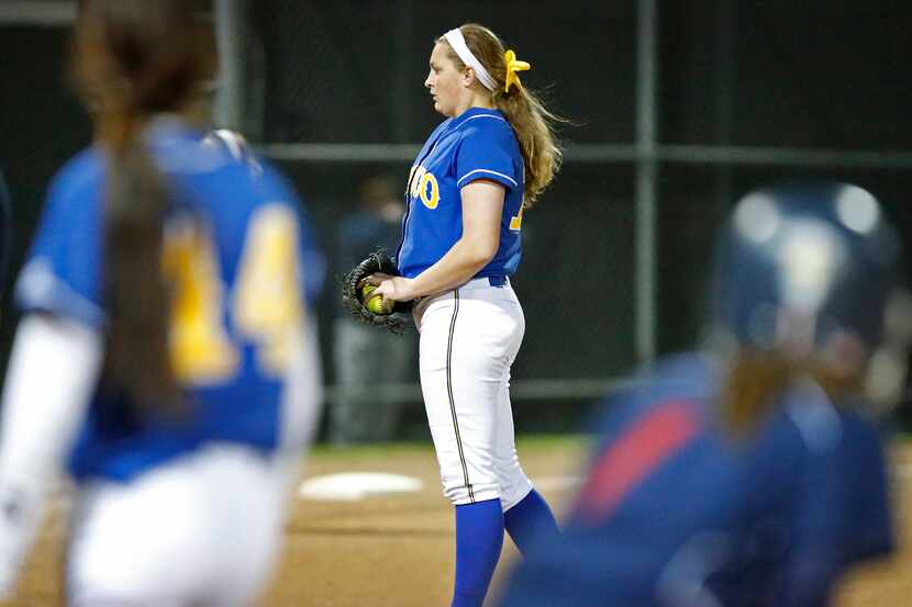 With runners on base in the fifth inning, Frisco High School pitcher Maddie MacGrandle (12)...