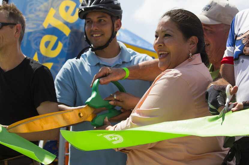 Monica Alonzo, councilwoman in District 6, cuts the ribbon at the newly opened Continental...