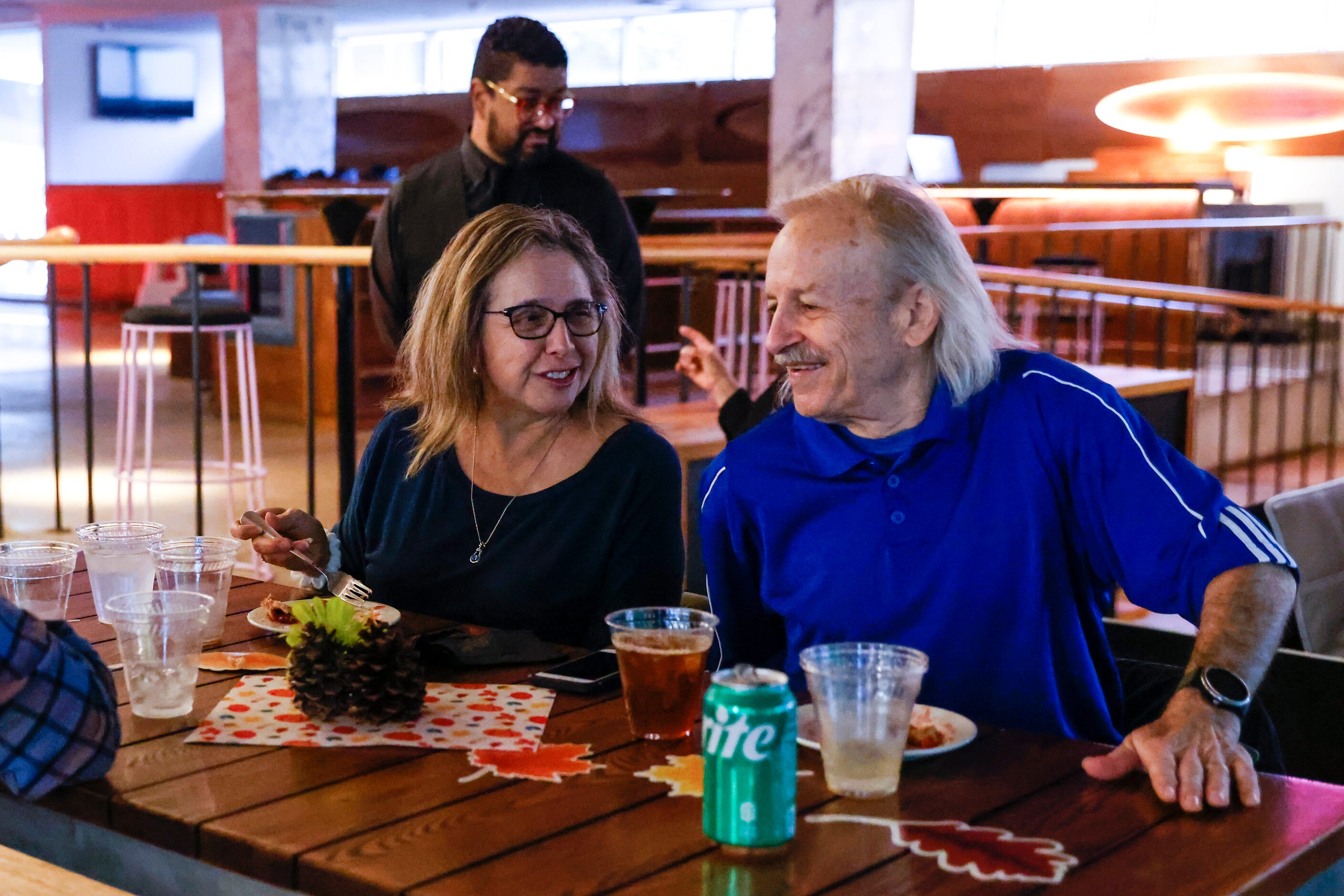 Laura Miller, left, engages with her husband  Maurice, an Army veteran, as they enjoy the...