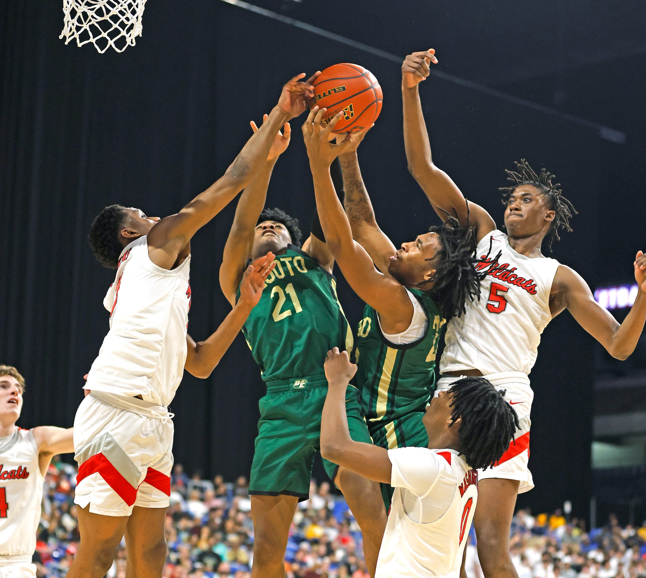 DeSoto Jaxxon Williams (21) battles a host of players for a rebound  including Richardson...