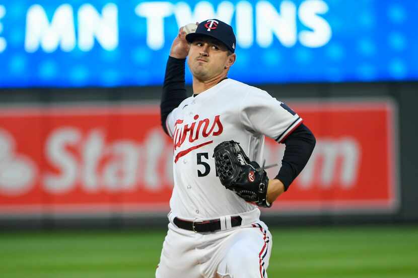 Minnesota Twins pitcher Tyler Mahle throws against the Washington Nationals during the third...