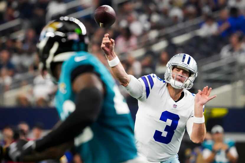 Dallas Cowboys quarterback Garrett Gilbert (3) throws a 19-yard touchdown  pass to wide...