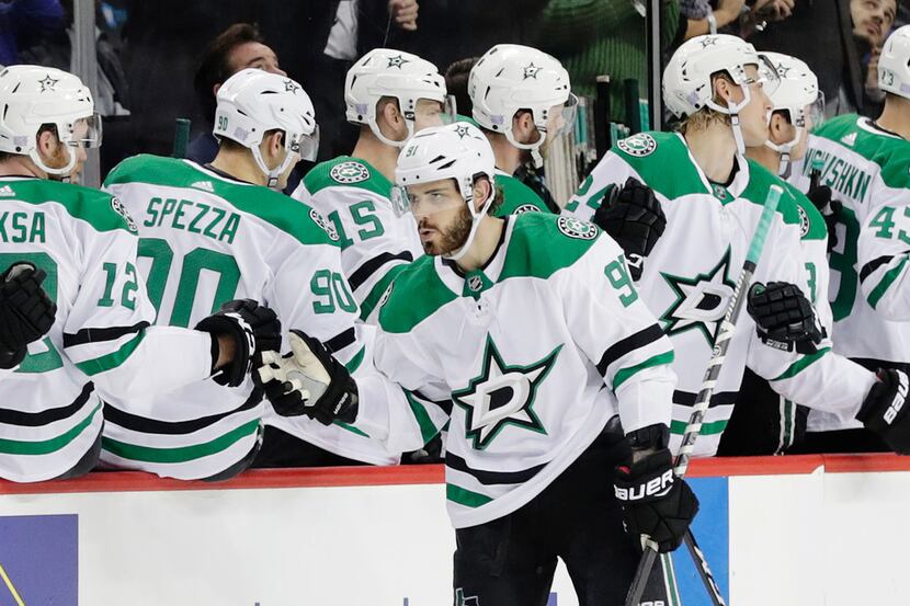 Dallas Stars' Tyler Seguin (91) celebrates with teammates after scoring a goal during the...