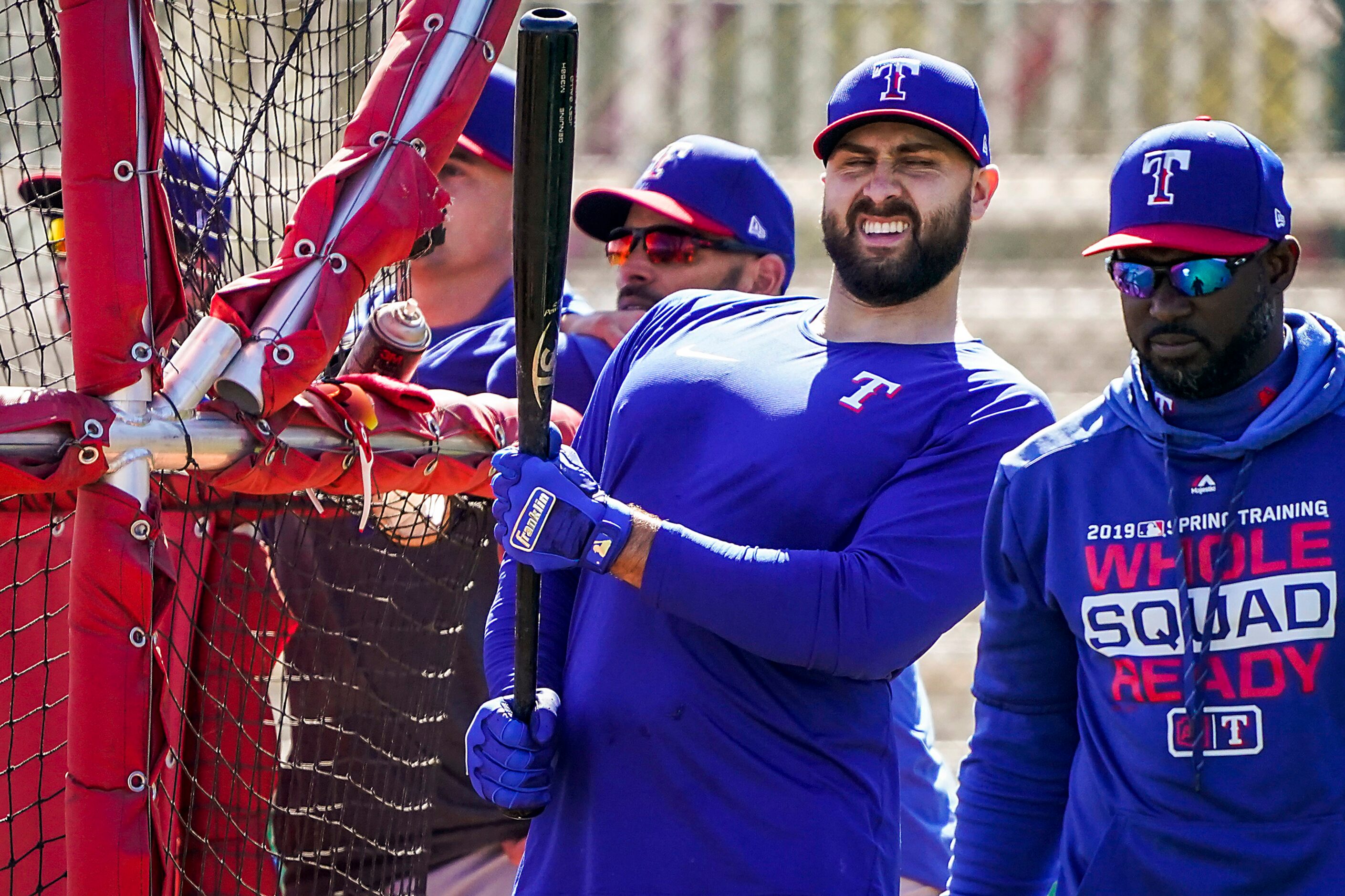 Texas Rangers outfielder Joey Gallo stretches while taking batting practice during a spring...