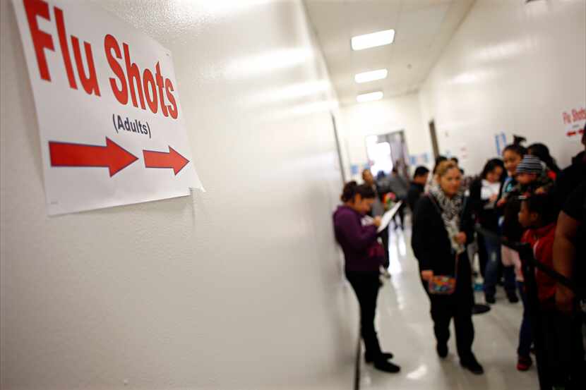 People lined up for flu shots at Dallas Health and Human Services on Thursday.