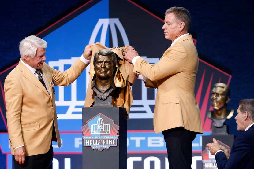 Pro Football Hall of Fame inductee Jimmy Johnson of the Dallas Cowboys (left) unveils his...