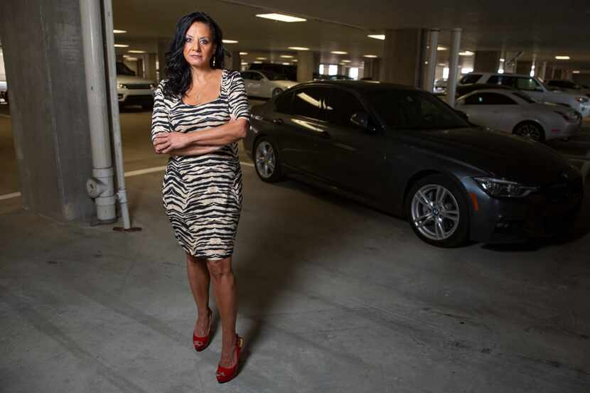 Melissa Anderson stands in the parking garage where not one but two Corvettes belonging to...