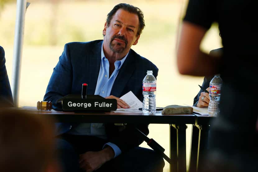 Mayor George Fuller listened to residents speak during a city council meeting last year.