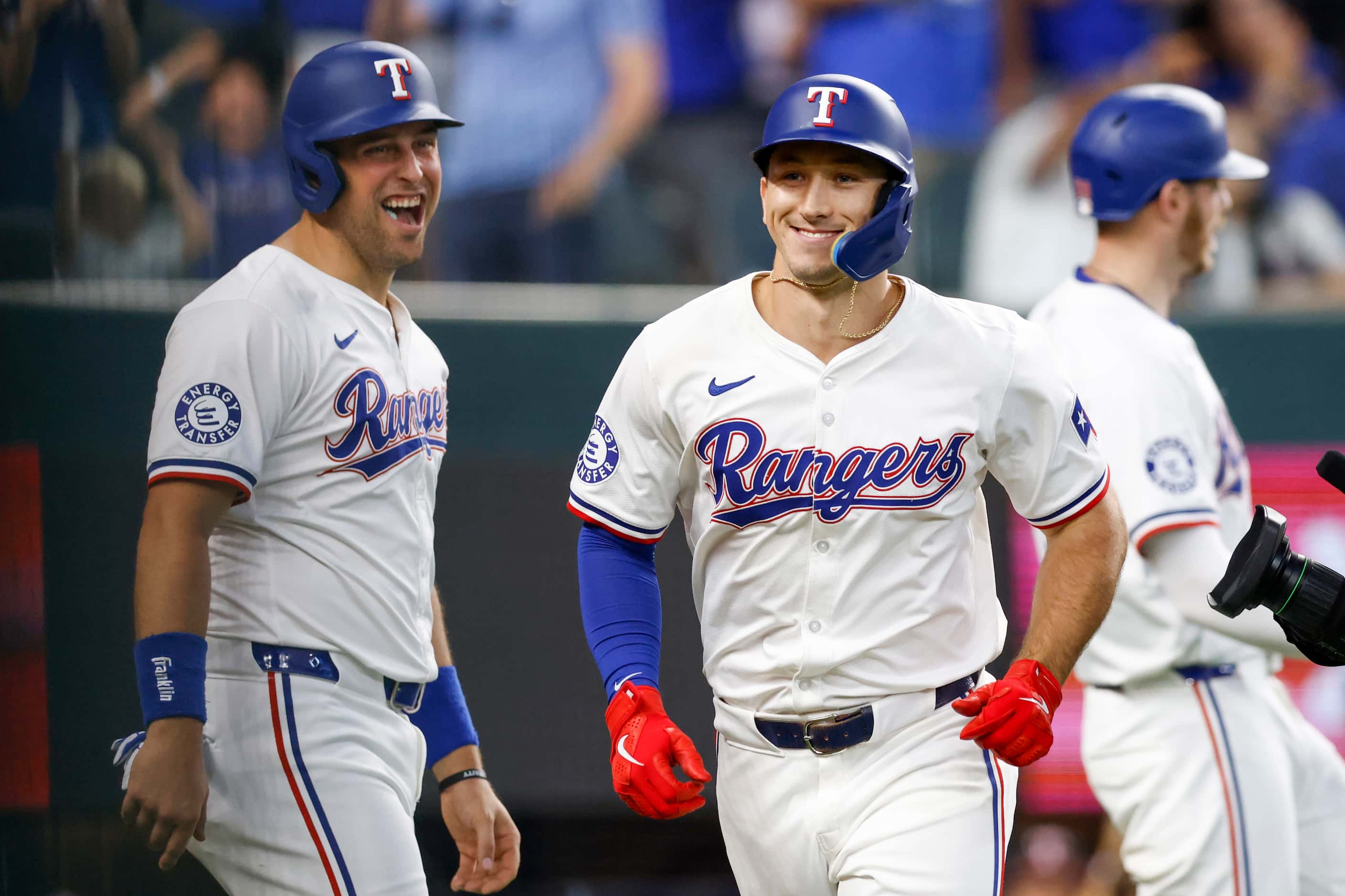 Texas Rangers first baseman Nathaniel Lowe (30) yells as he celebrates a grand slam by left...