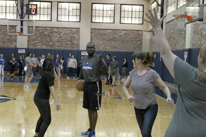 Dallas Mavericks Assistant Coach Darrell Armstrong demonstrates defensive drills during the...