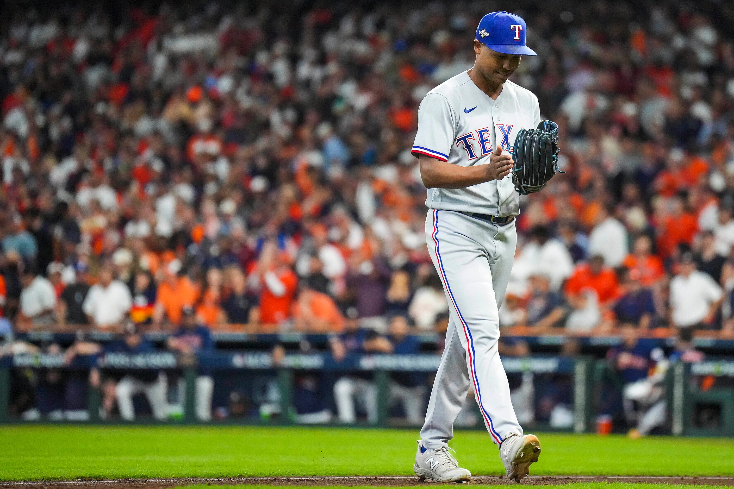 Texas Rangers relief pitcher Jose Leclerc reacts after a groundout by the Houston Astros’s...