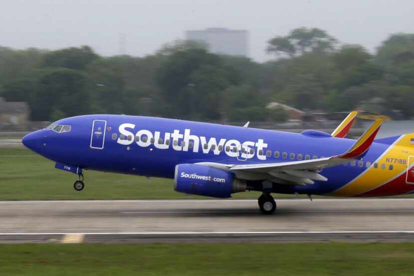 FILE- In this April 23, 2015, file photo, a Southwest airlines jet takes off from a runway...