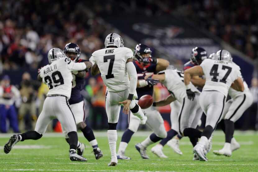 Oakland Raiders punter Marquette King (7) kicks away against the Houston Texans during the...