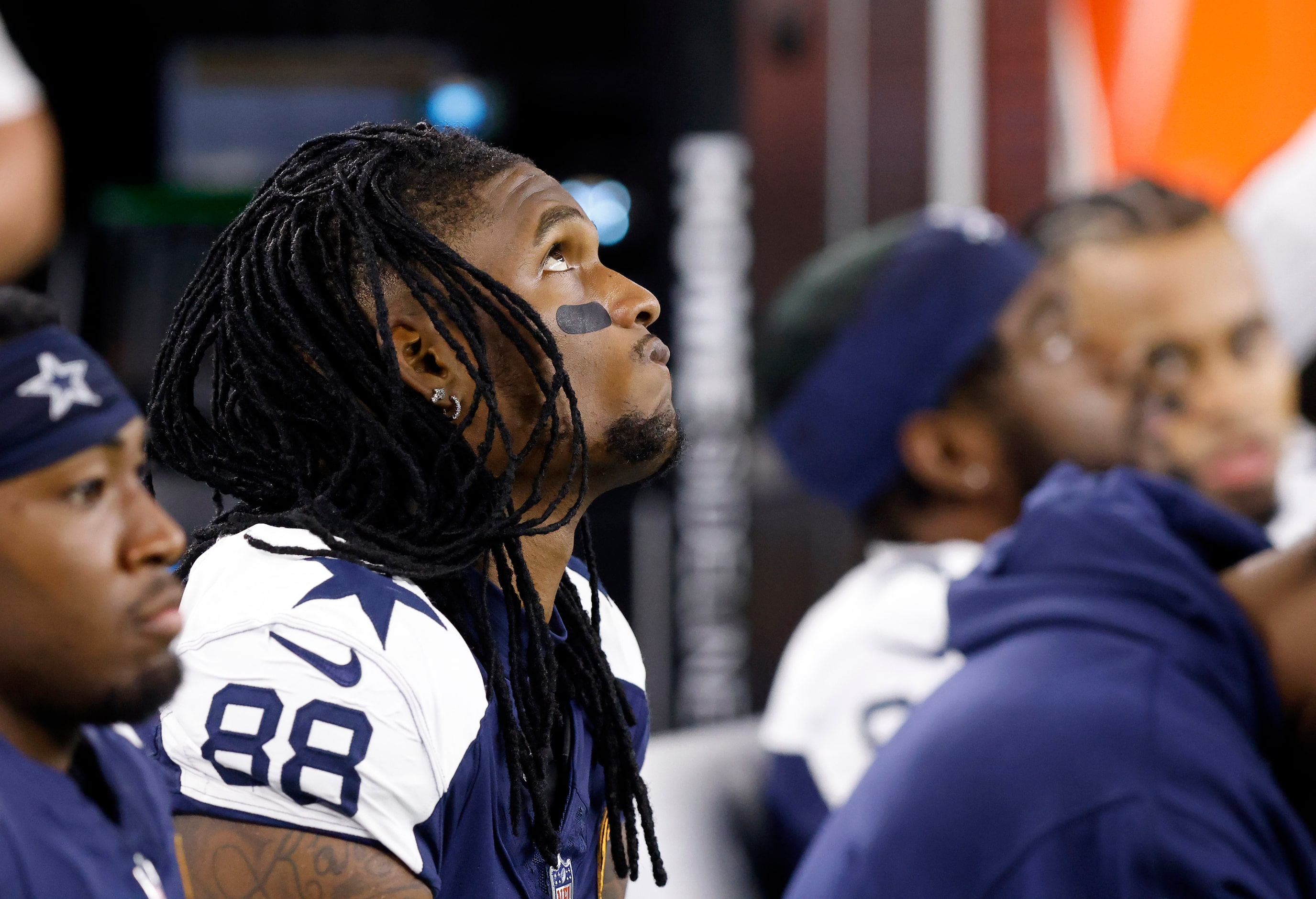 Dallas Cowboys wide receiver CeeDee Lamb (88) watches the game from the bench during the...