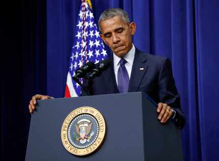 President Barack Obama pauses as he speaks about the mall shooting in Munich, Germany,...