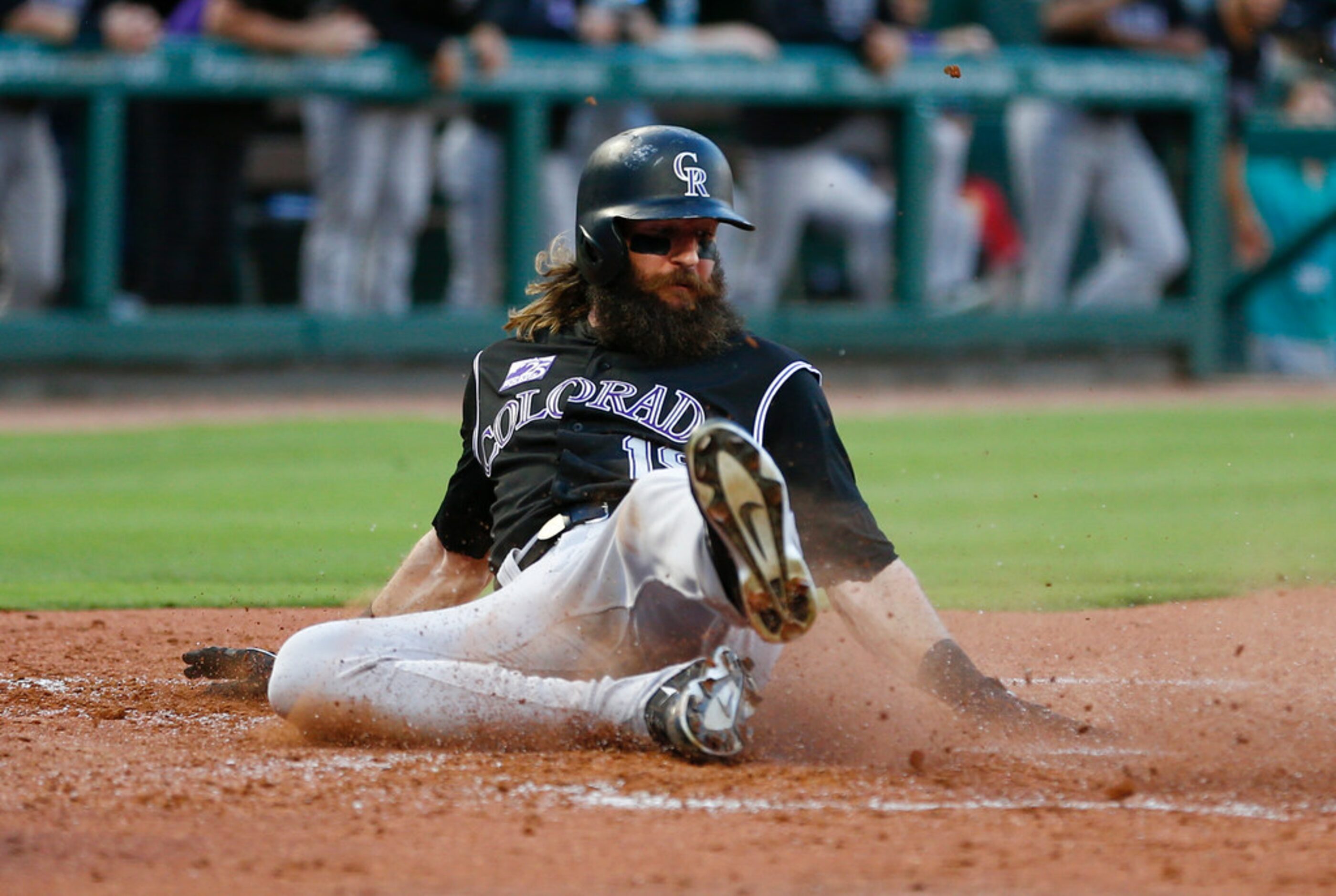 Colorado Rockies' Charlie Blackmon scores on a two-run double by Nolan Arenado against the...