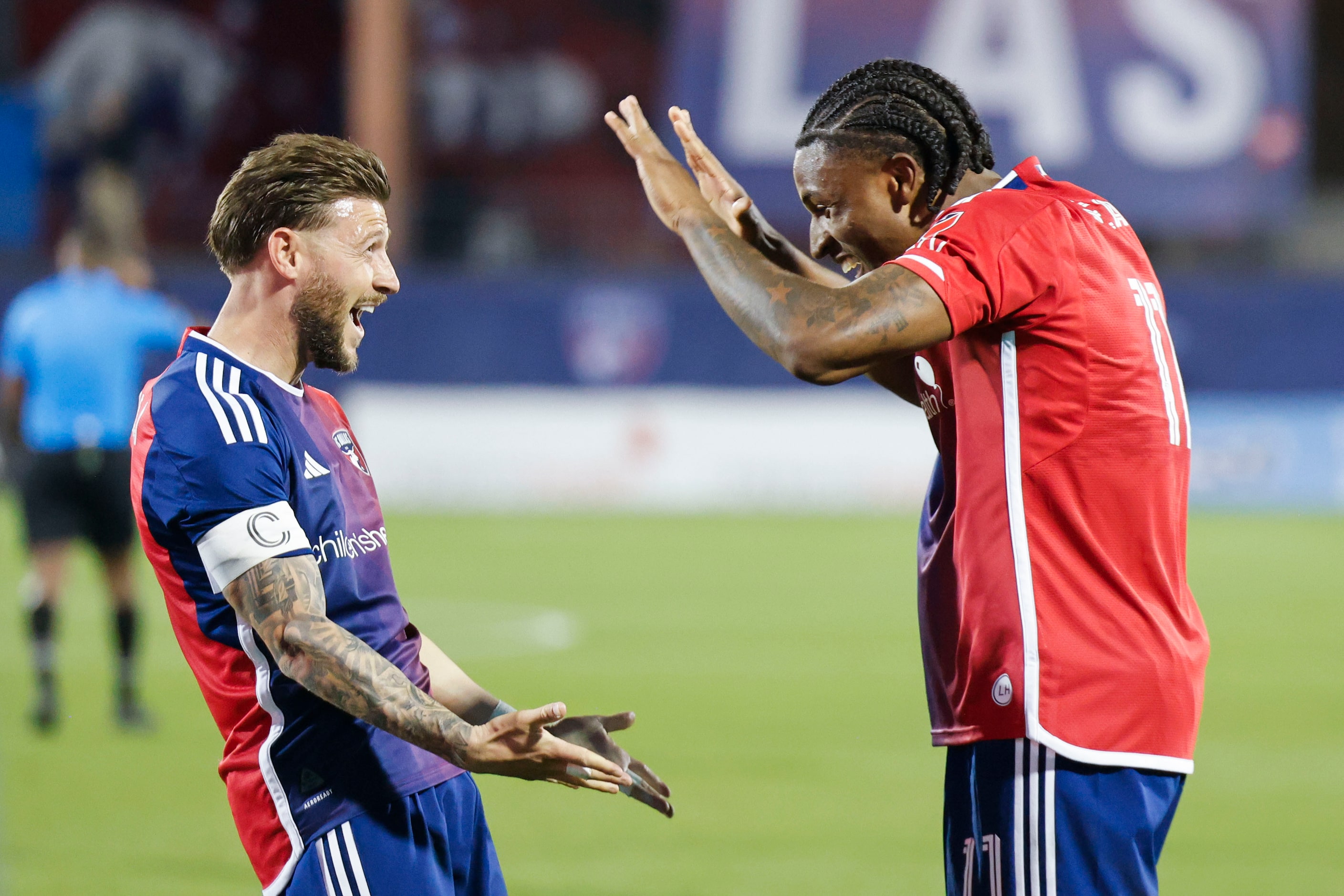 FC Dallas forward Paul Arriola (left) cheers with FC Dallas forward Dante Sealy after...