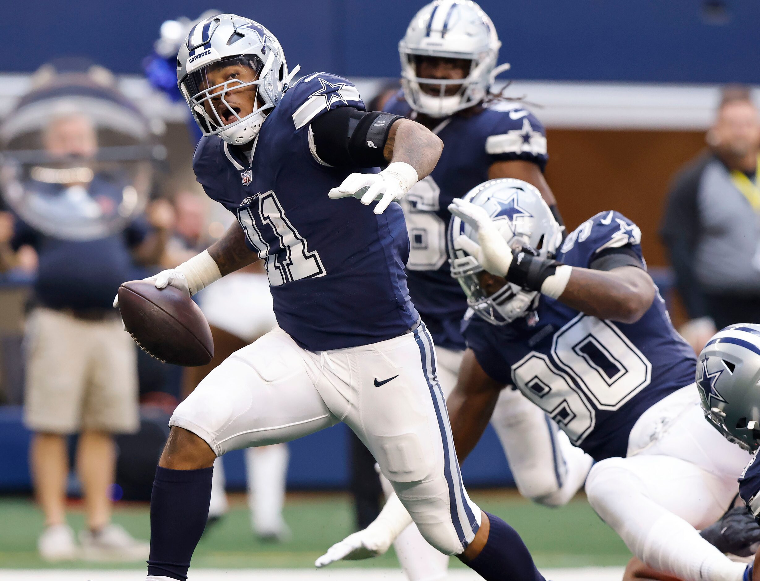 Dallas Cowboys linebacker Micah Parsons (11) returns a Chicago Bears fumble for a touchdown...