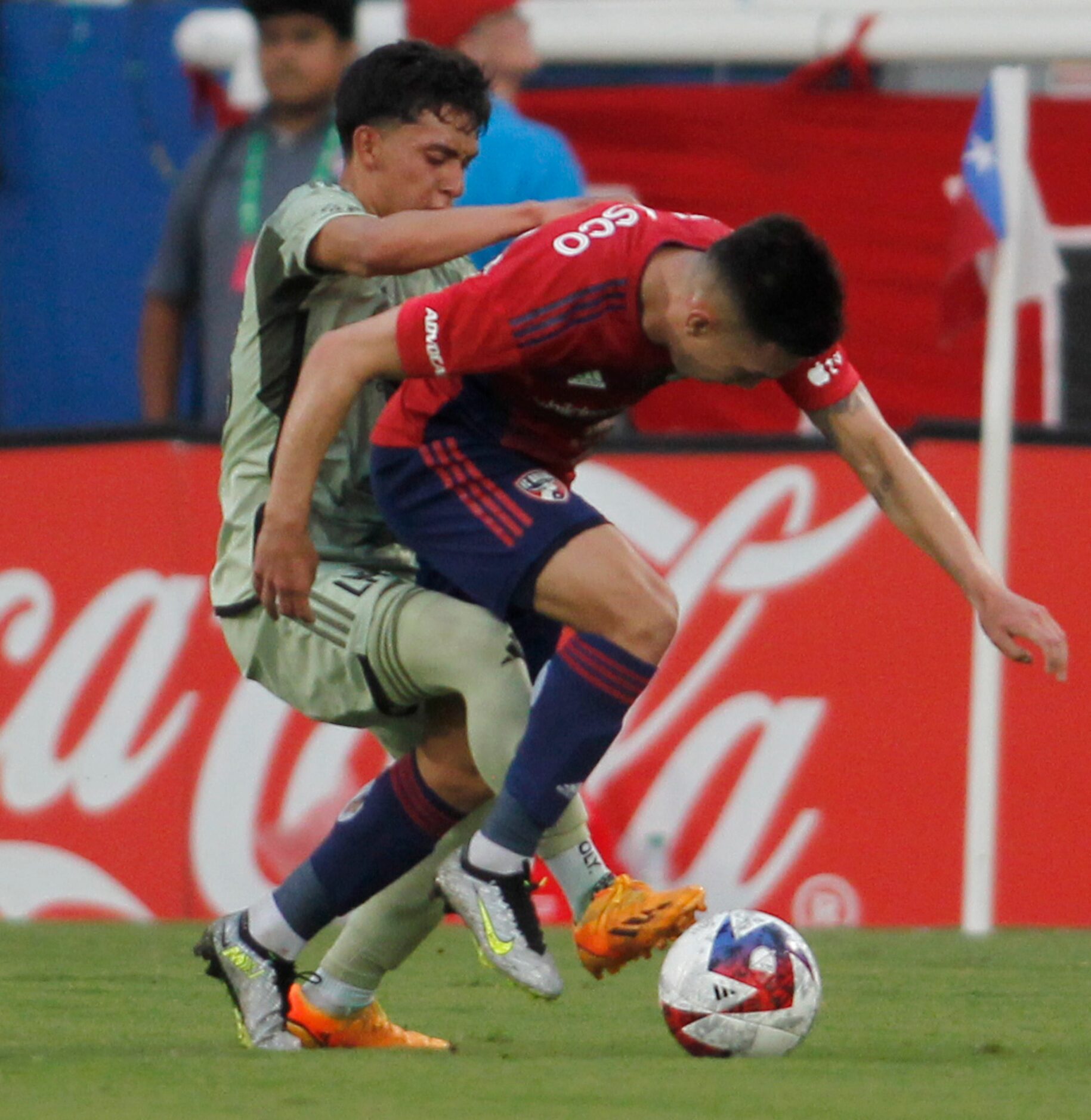 FC Dallas attacker Alan Velesco (20), center, tangles with LA FC defender Erik Duenas (18)...