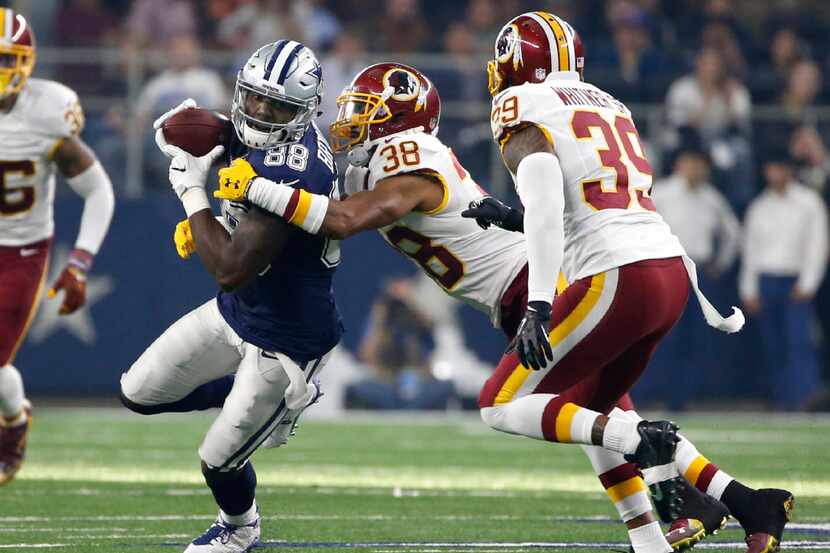 Dallas Cowboys wide receiver Dez Bryant (88) looks for running room after catching a pass as...