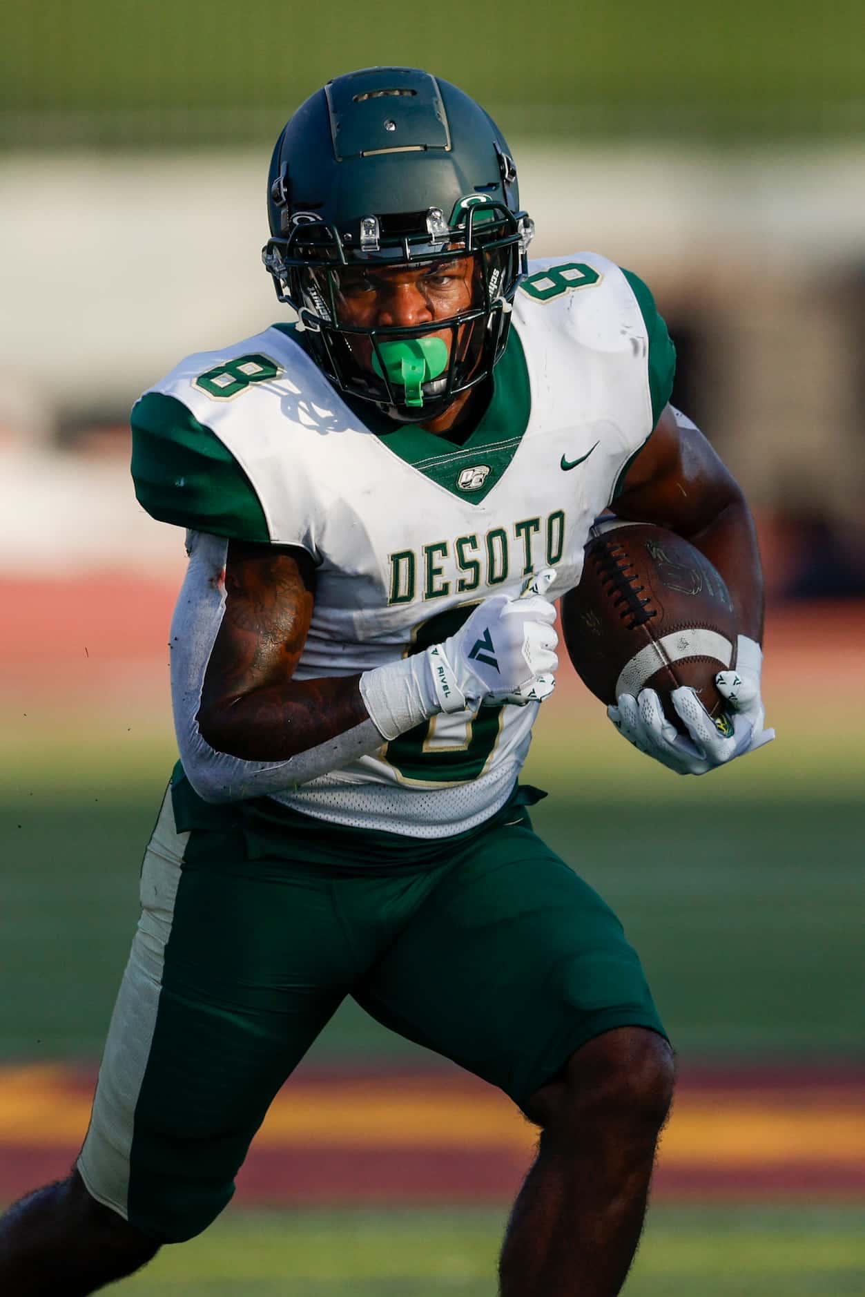 DeSoto running back Jaden Trawick (8) runs the ball during the first half of a football game...