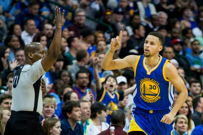 Golden State Warriors guard Stephen Curry celebrates after hitting a 3-pointer during the...