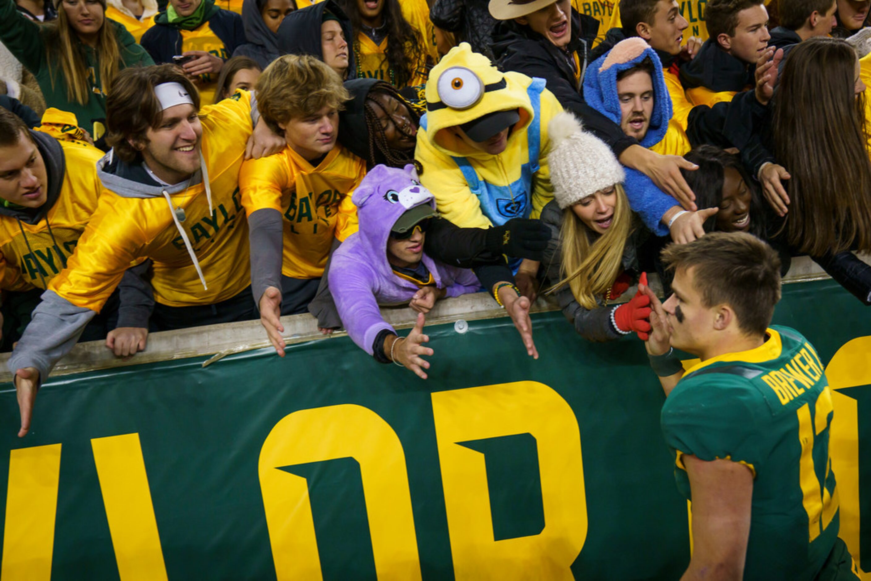 Baylor quarterback Charlie Brewer (12) celebrates with fans after a victory over West...