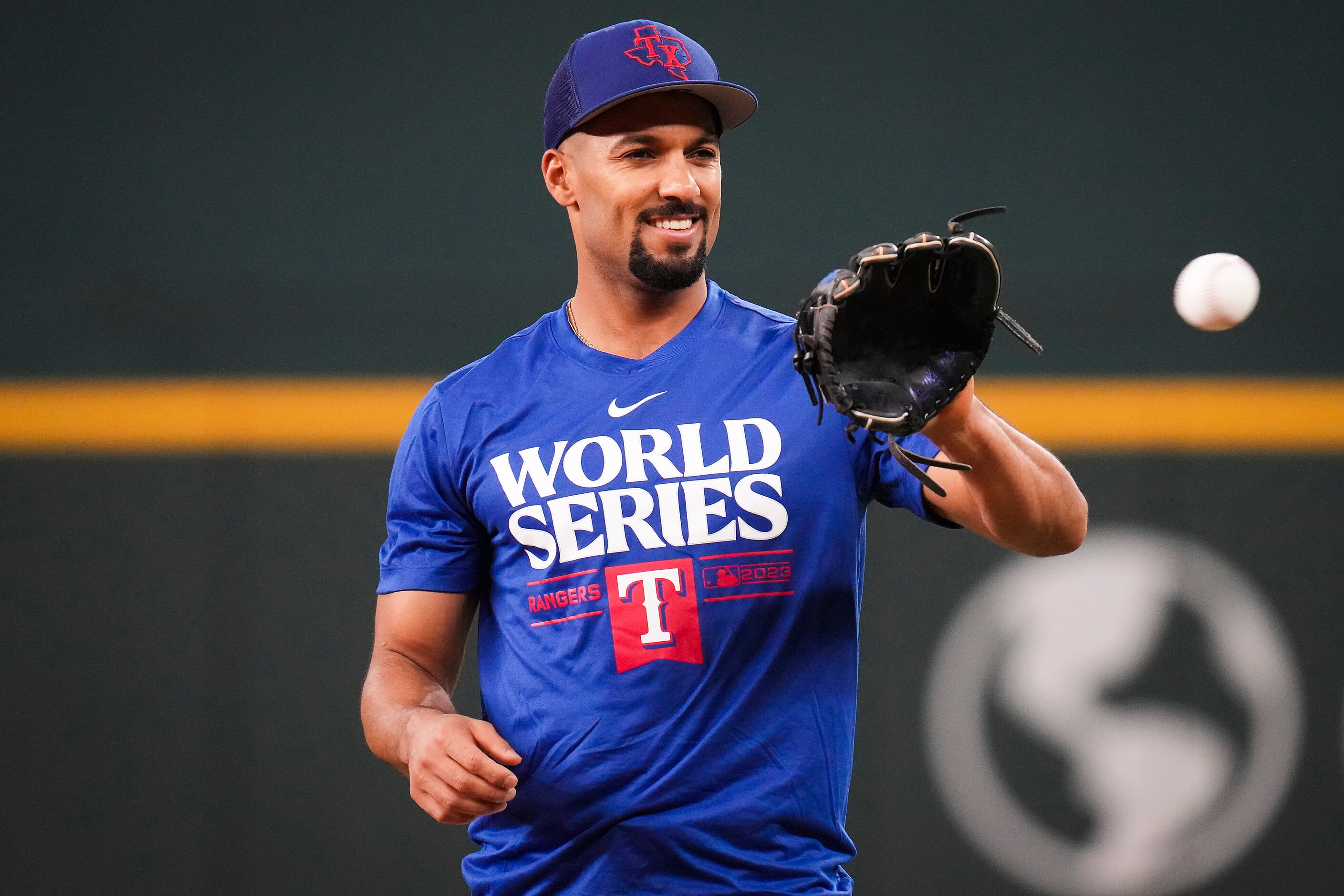 Texas Rangers second baseman Marcus Semien plays catch during a team workout at Globe Life...