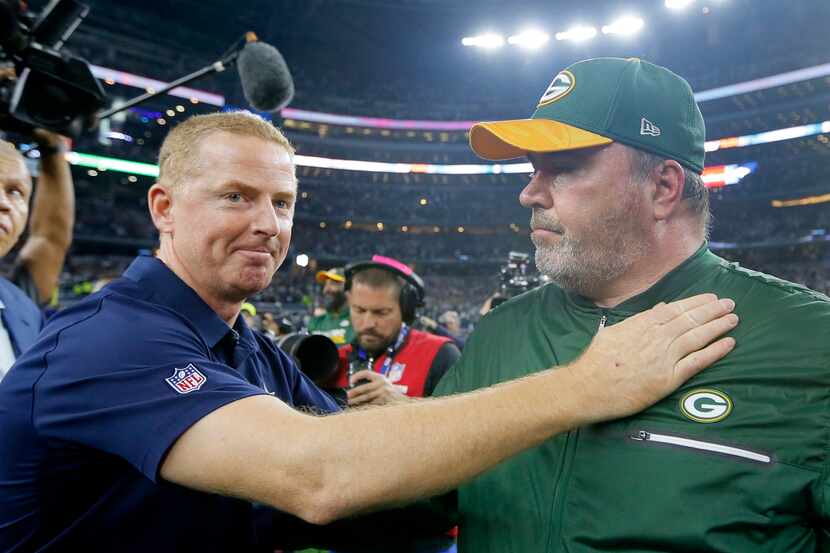 In this Jan. 15, 2017, photo, Dallas Cowboys coach Jason Garrett, left, congratulates Green...