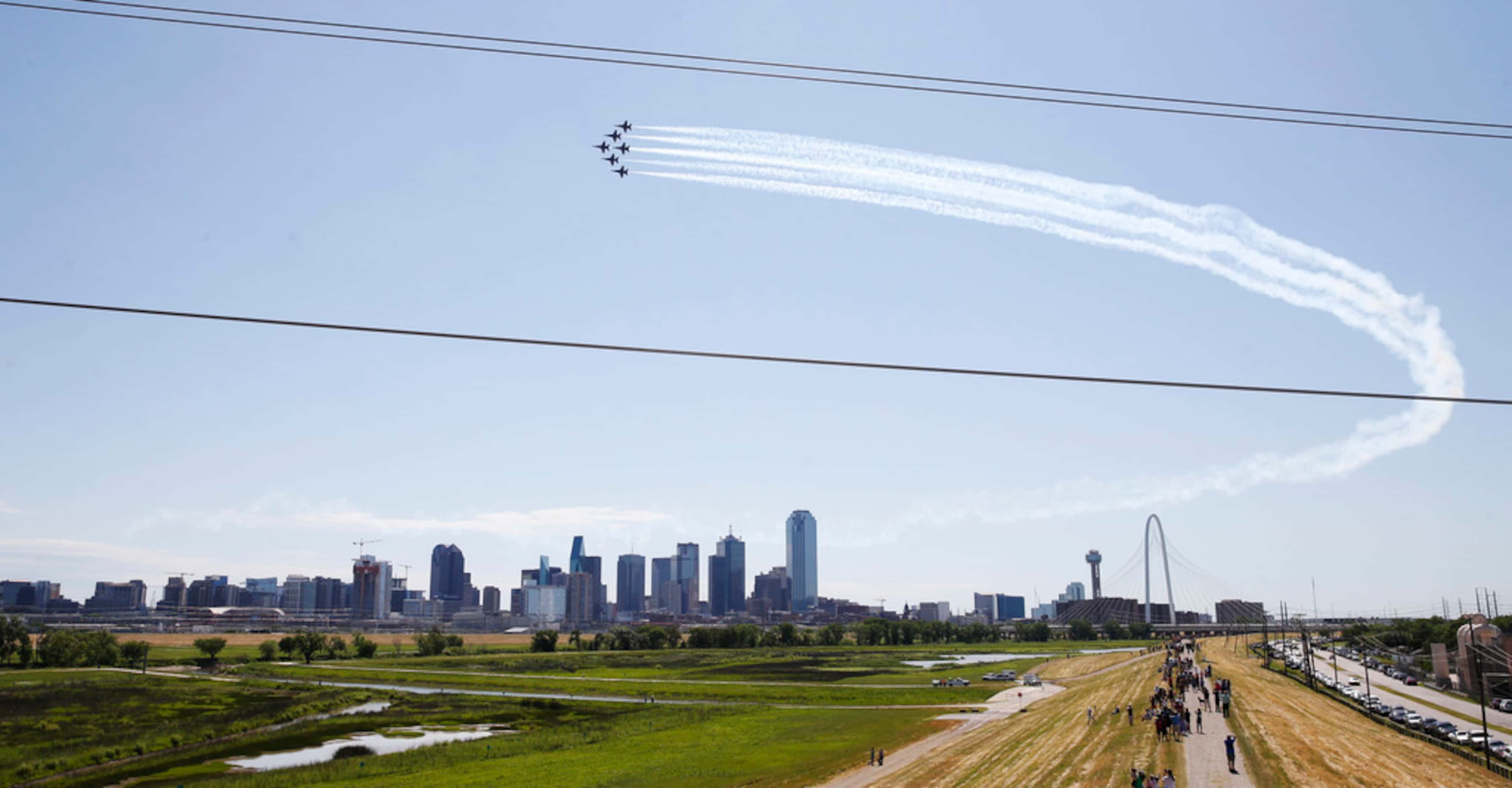 The U.S. Navy Blue Angels fly over downtown Dallas during the "America Strong" flyover event...