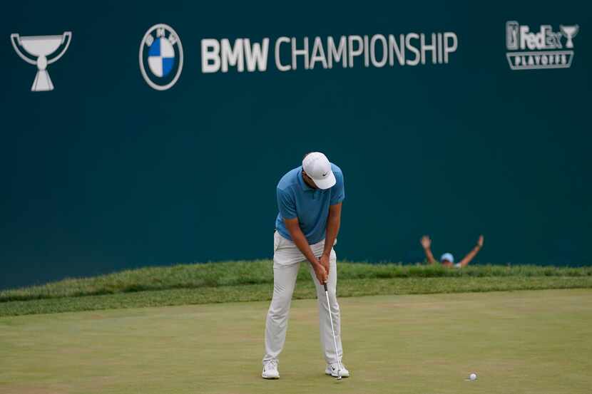 Scottie Scheffler misses a putt for par on the 18th hole during the final round of the BMW...
