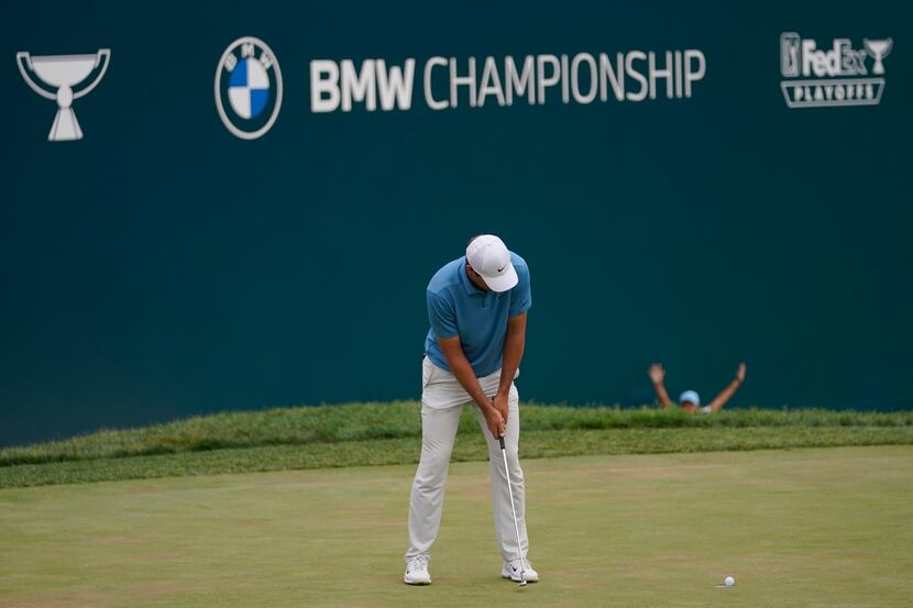 Scottie Scheffler misses a putt for par on the 18th hole during the final round of the BMW...