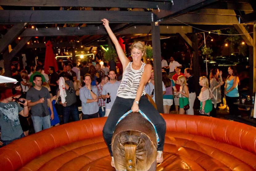 The mechanical bull draws a crowd at The Trophy Room in Uptown.