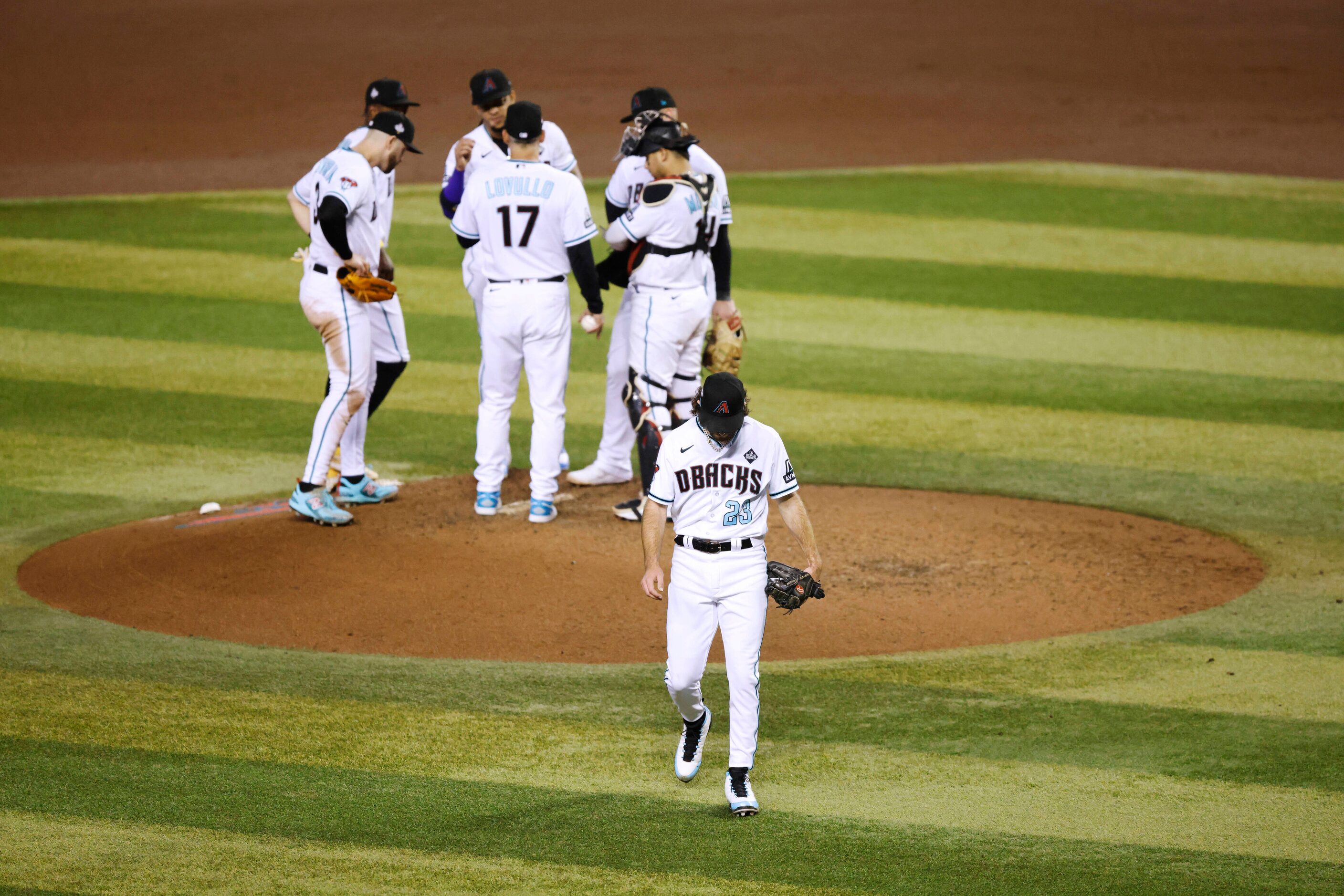 Arizona Diamondbacks starting pitcher Zac Gallen (23) is relieved during the seventh inning...