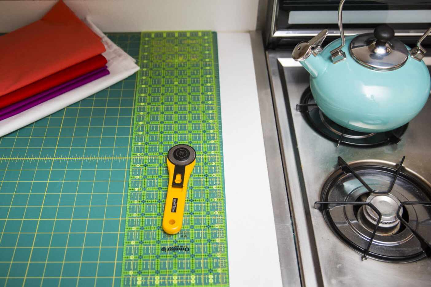 The cutting space of quilter Kristi Schroeder shares the kitchen at her one-bedroom Park...
