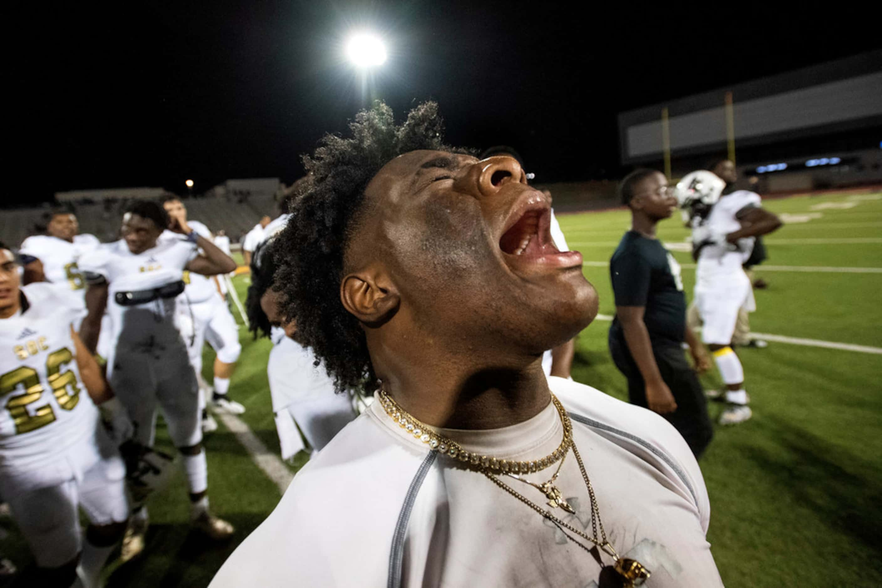 South Oak Cliff senior linebacker Ra'Kwuan Pinkston (9) leads his team in a celebratory...