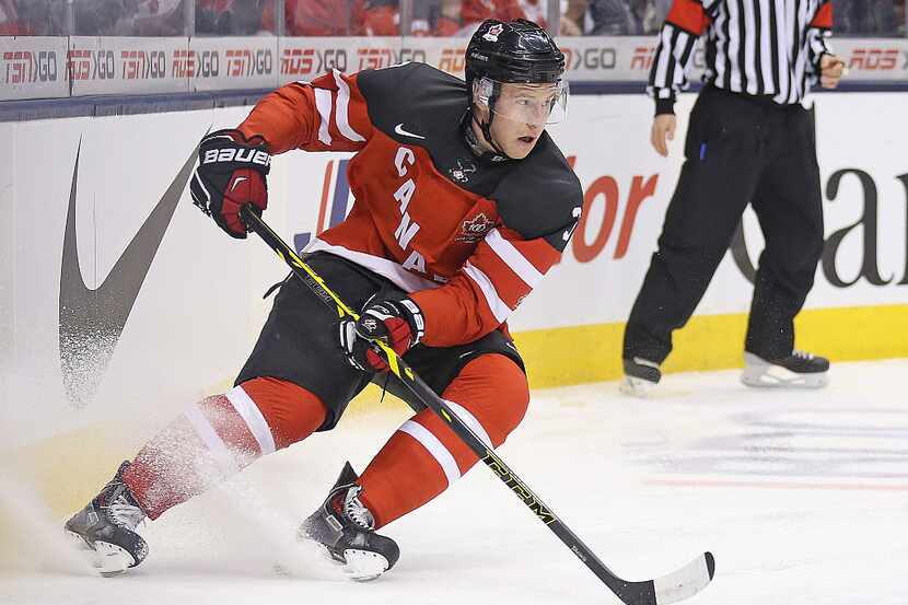 TORONTO, ON - JANUARY 5:  Dillon Heatherington #3 of Team Canada turns with the puck against...