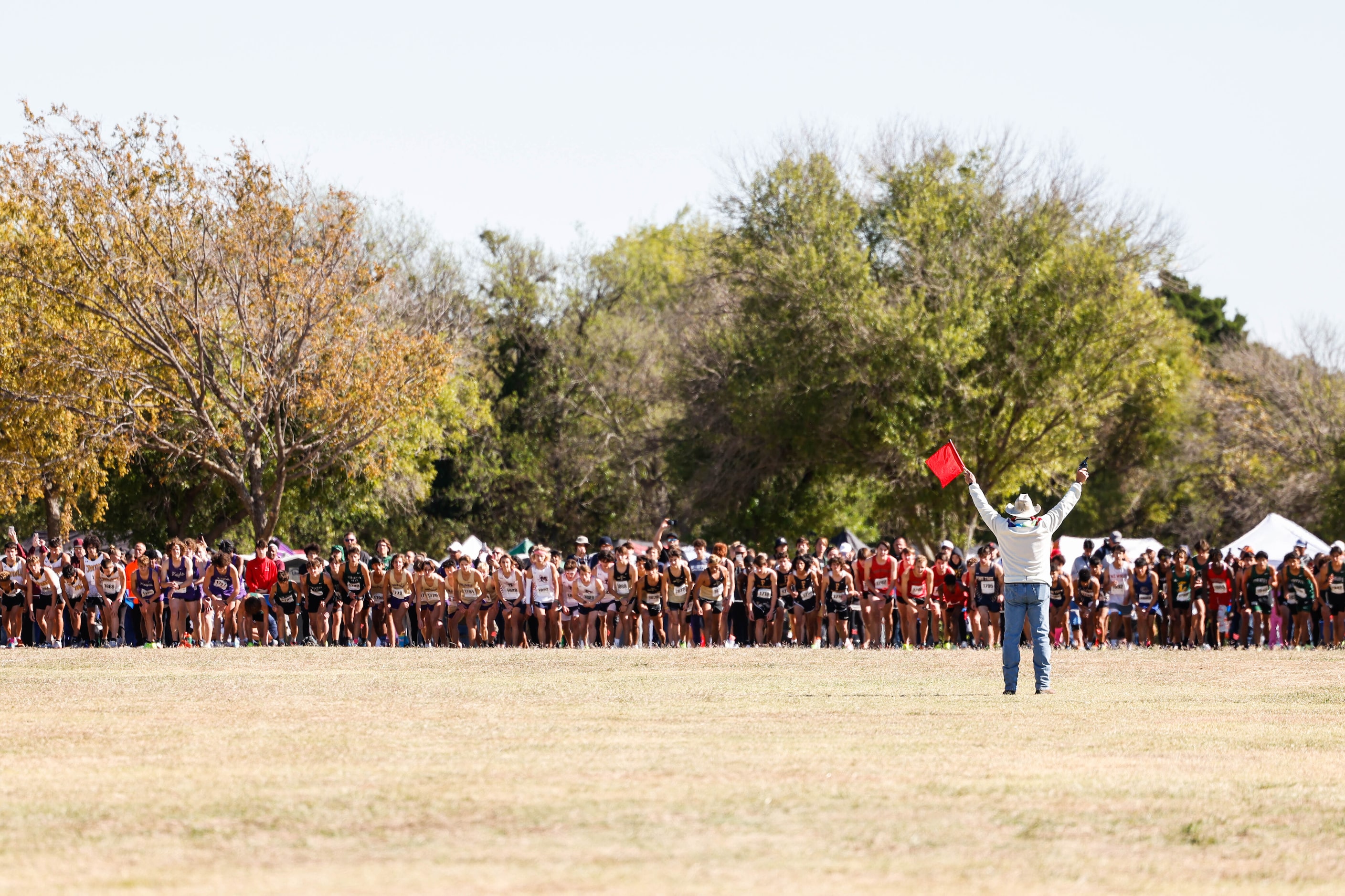 Class 5A boys UIL Region Cross Country Championships race starts at Lynn Creek Park in Grand...